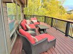 The upstairs back deck has great seating